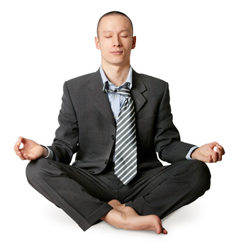 businessman in lotus pose meditating